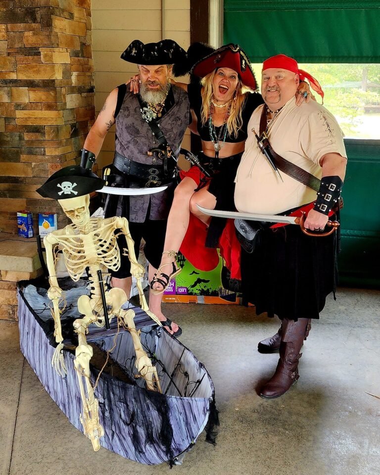 three entertaining pirates with a skeleton